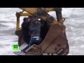 Crazy ferry video: Russians cross river in backhoes