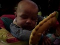 Funny baby sleeping in his jumper