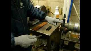 One of many ways to sharpen a knife--this one uses a buffing wheel on a One of many ways to sharpen a knife--this one uses a buffing wheel on a