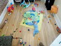 Time lapse of a baby playing with his toys