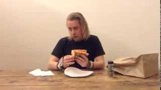 Macaulay Culkin Eating a Slice of Pizza