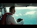 Amazing Stunt: Skydiver Flies Under Snowmobile