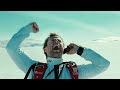 Amazing Stunt: Skydiver Flies Under Snowmobile