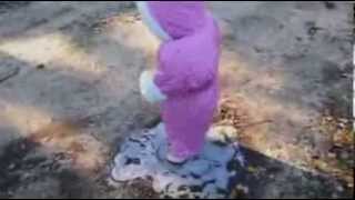 Little girl in pink snow suit experiences ice for first time