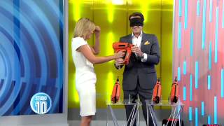 Presenter almost shoots herself in the face with nail gun