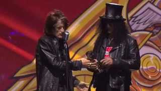 Slash receives the APMAs Guitar Legend Award, introduced by Aerosmith's Joe Perry