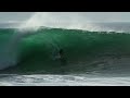 Kelly Slater and Joel Parkinson surfing big waves in Praia do Norte Nazare
