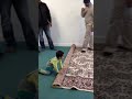 Baby helping to fold carpet in church ...funny ending...