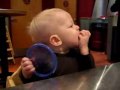 Cute little baby boy eating lime - funny expressions