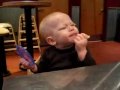 Cute little baby boy eating lime - funny expressions