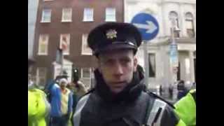 Cowardly member of AN GARDA SIOCHANA   attacks peaceful protesters and peppers sprays them