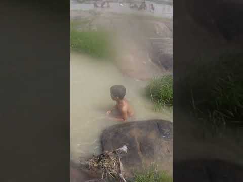 Funny boy injoy with water
