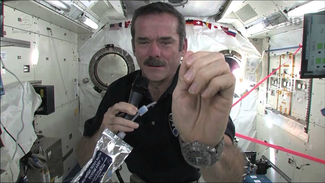 Chris Hadfield demonstrates how astronauts wash their hands in zerog