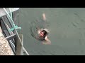 Crazy girl jumps 15 feet into canal