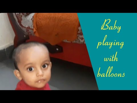 Funny baby playing with balloons 🎈