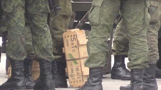 Russian soldiers load live ammunition 5 45 for AK 74 or RPK 74 in Crimea Ukraine