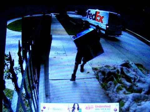 Fed-Ex driver throws fragile package over fence - YouTube