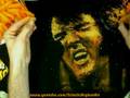 Elvis Presley Painting with Cheese Puffs on Velvet - Cheesy Art  in Cheetos