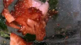 Strawberry dropped into a blender in slow motion