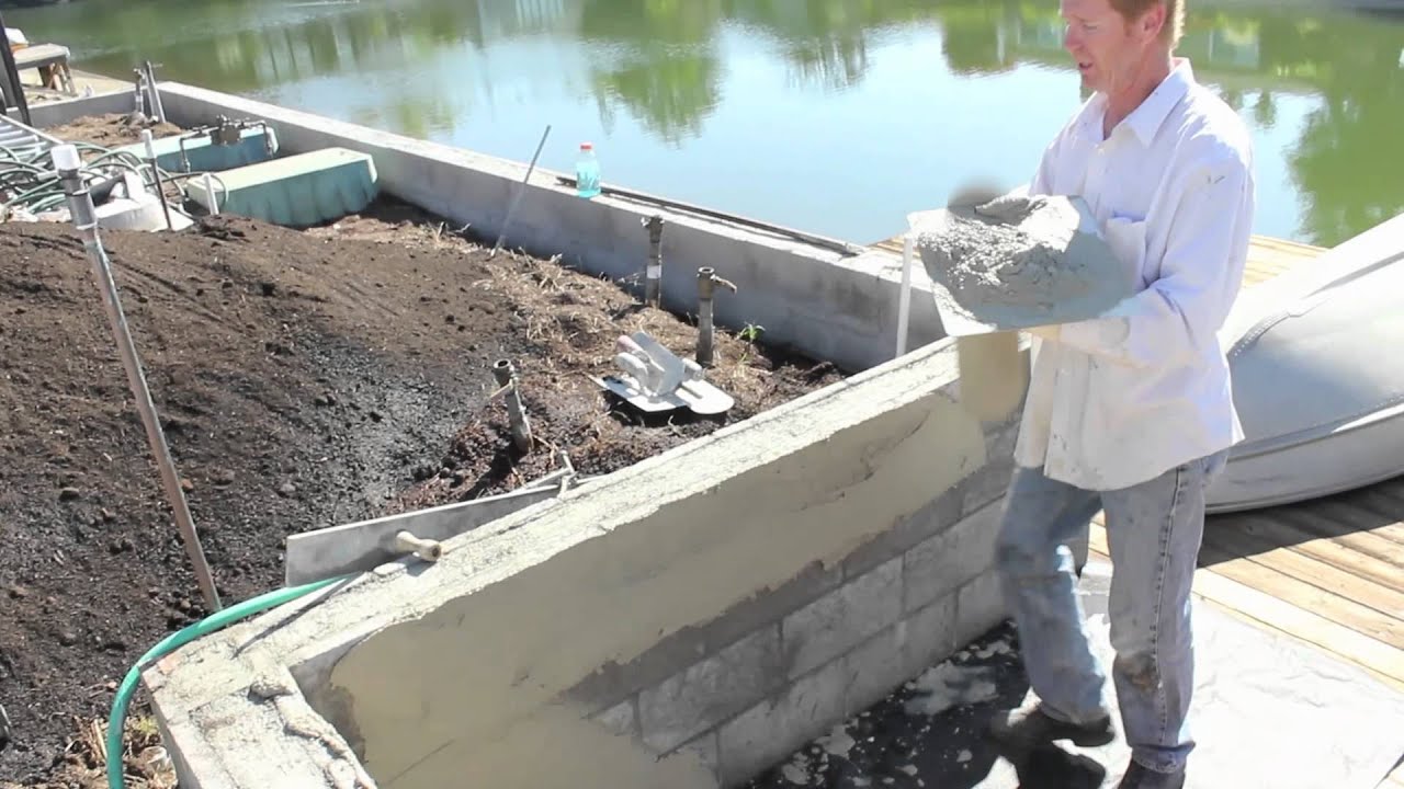 How to skim coat cinder block walls - YouTube