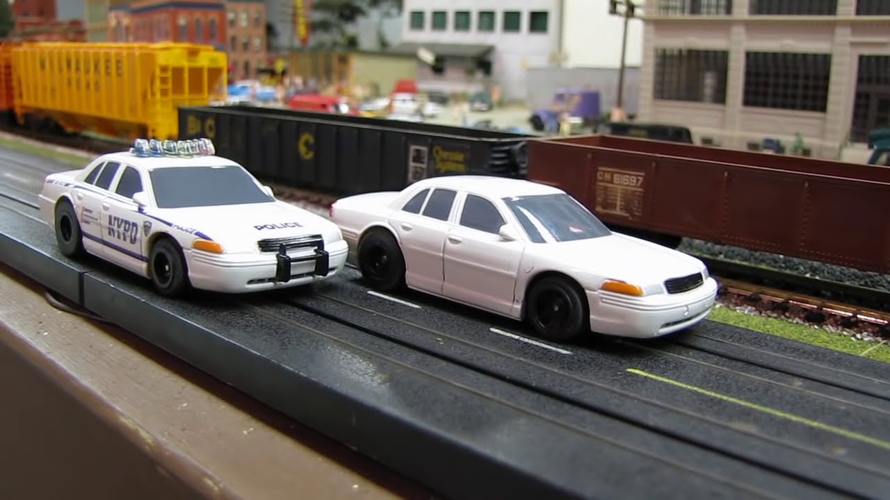 Layout with HO Model Trains and Slot Cars - YouTube