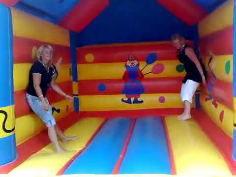 Fun of older women at the bounce castle