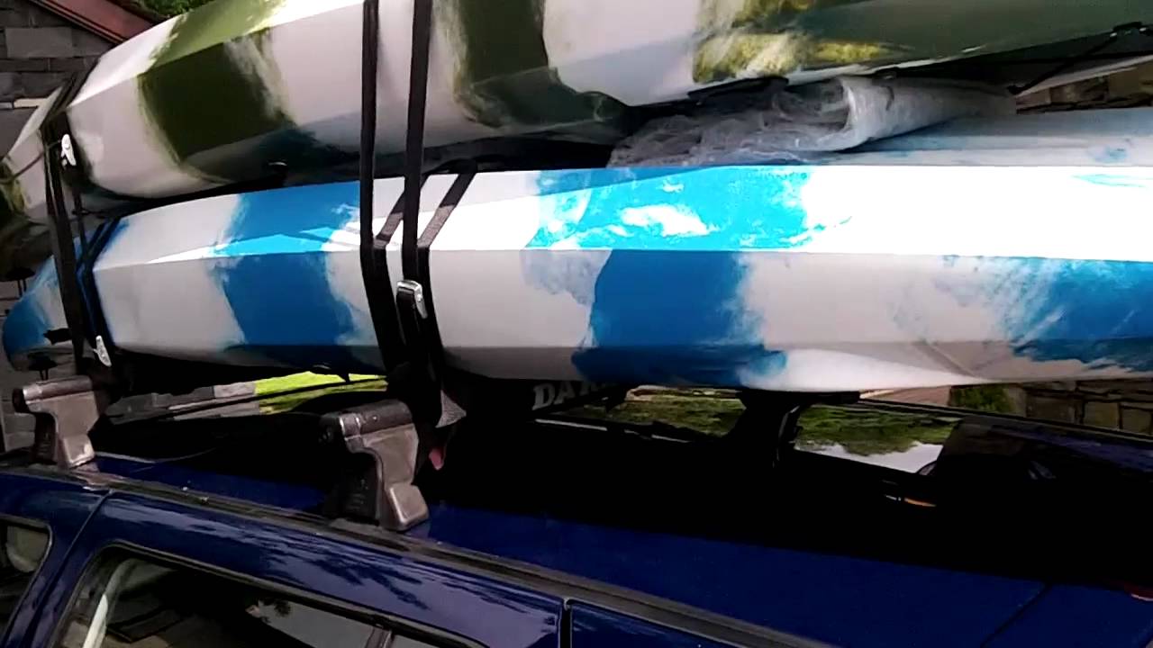 Kayaks or canoes on a car roof rack - YouTube
