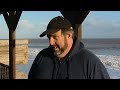 Worst tidal surge in 60 years batters UK east coast and drags homes into the sea