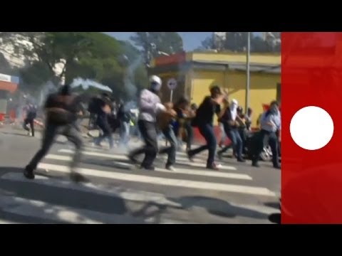 Police in the Brazilian city of Sao Paulo have used tear gas to break up a protest just hours before the city hosts the opening World Cup match. At least five people have been reported injured including a journalist from US television network CNN.

Protesters had tried to block a road linking the Corinthians Arena. The demonstration took place around 13km from the stadium where Brazil will play Croatia in the opening match. Riot police attempted to disperse the estimated 50 protesters with tear gas and rubber bullets. 

What is in the news today? Click to watch: http://eurone.ws/1kb2gOl

euronews: the most watched news channel in Europe
Subscribe! http://eurone.ws/10ZCK4a

euronews is available in 14 languages: http://bit.ly/1qPwqgE

In English:
Website: http://www.euronews.com/news
Facebook: http://www.facebook.com/euronews
Twitter: http://twitter.com/euronews
Google+: http://google.com/+euronews
VKontakte: http://vk.com/en.euronew