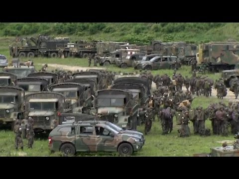 South Korean troops traded fire near an elementary school Sunday with a cornered conscript soldier who had fled after shooting dead five members of his unit on the border with North Korea. Duration: 00:32