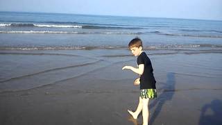 Mma kid sparring on the beach