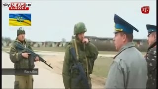 Russian troops fire shots over the heads of Ukrainian air force personnel in Belbek Crimea