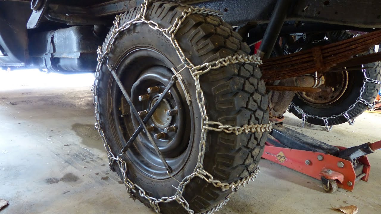Installing snow tire chains Heavy duty cleated vbar chains on my
