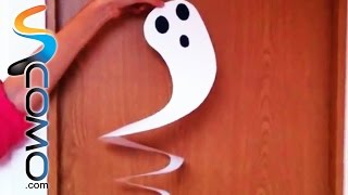 Haciendo fantasmas colgantes como decoración en Halloween