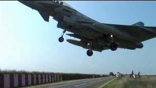 Typhoon jet flys ridiculously close to the ground over people