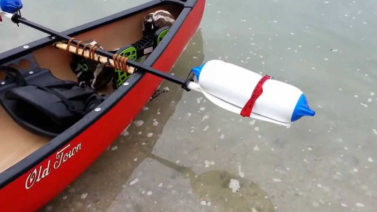 How to make a canoe outrigger system from boat fenders and a paddle 