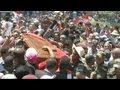 Thousands of people gathered in Tunis to see the coffin of opposition politician Mohamed Brahmi...

euronews, the most watched news channel in Europe
Subscribe for your daily dose of international news, curated and explained:http://eurone.ws/10ZCK4a
Euronews is available in 13 other languages: http://eurone.ws/17moBCU

http://www.euronews.com/2013/07/27/tunisia-funeral-of-assassinated-mp-brahmi-draws-huge-crowds
Thousands of people gathered in Tunis to see the coffin of opposition politician Mohamed Brahmi being carried through the streets ahead of his state funeral. He was shot dead outside his house on July 25.

The Interior Ministry said earlier that Brahmi, 58, had been killed with the same gun used to assassinate secular leader Chokri Belaid on February 6. Demonstrators gathered in honour of Brahmi\'s funeral carried portraits of both politicians.

The killing of Brahmi has sparked protests against Tunisia\'s Islamist-led government in the capital Tunis and other cities, including Sidi Bouzid, Sfax, Kairouan and Kef.

Police reportedly used tear gas to break up the demonstrations. Witnesses said an anti-government protester died in the southern city of Gafsa during the unrest.


Find us on:  
Youtube http://bit.ly/zr3upY 
Facebook http://www.facebook.com/euronews.fans
Twitter http://twitter.com/euronews