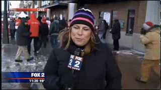 Red Wings Fan Slips on Ice During Live News Shot (FAIL)