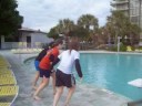 3 girls jumps in pool