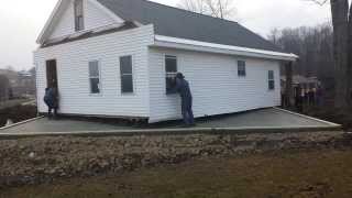 80 Amish people pick up house and move it