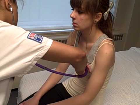 Girl On Examination Table In Physiotherapy Surgery Stock 