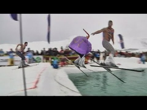 Fancy dress skiers plunge into cold water at Red Bull event
