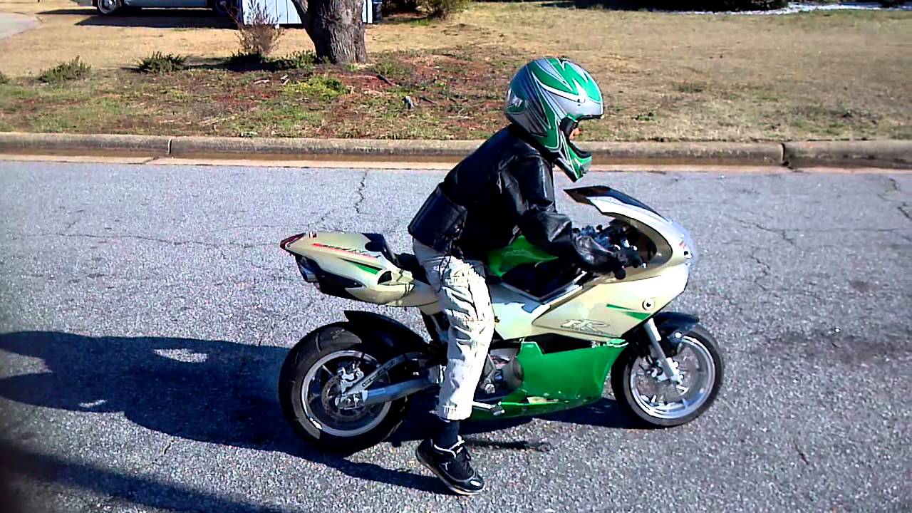 8 year old on mini motorcycle - YouTube