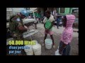 Distribution d'eau dans les rues d'Haïti