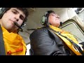 Extreme small plane landing on a ship at sea