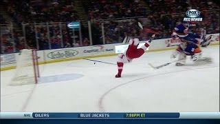 Darren Helm flips over Poulin and scores