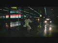 Woman in a rainstorm at an airport