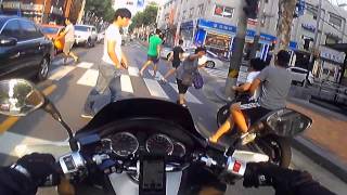 Unregistered motorcycle's aggresive driving in front of police car..