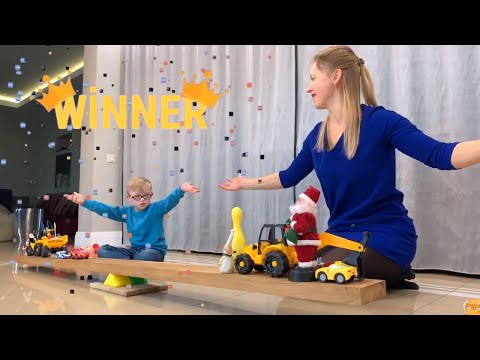 Sunny Vanya and Mom check which toy is heavier on a big scales
