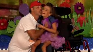 Kenzie dancing with her dad